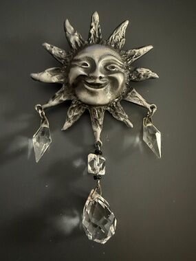 silver-toned sun brooch textured metal sun face with dangling crystal accents
